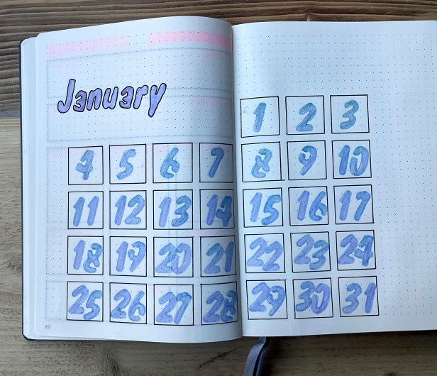 Month of January with a box for each day layer out like a calendar by week. The numbers for each day are coloured in pale purple in each box.