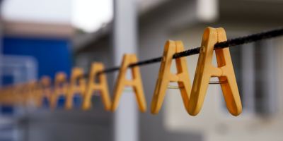 Yellow plastic pegs on a clothes line. The way they hang it looks like A A A A A A A. The ages get smaller and disappear into the distance.